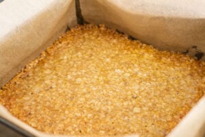 Cooked flapjack mixture cooling down in the tin